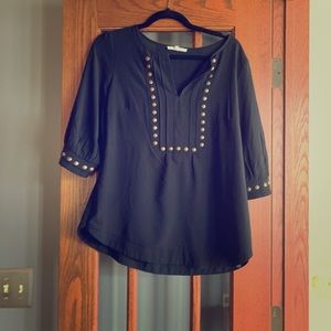 Black blouse with brass accents
